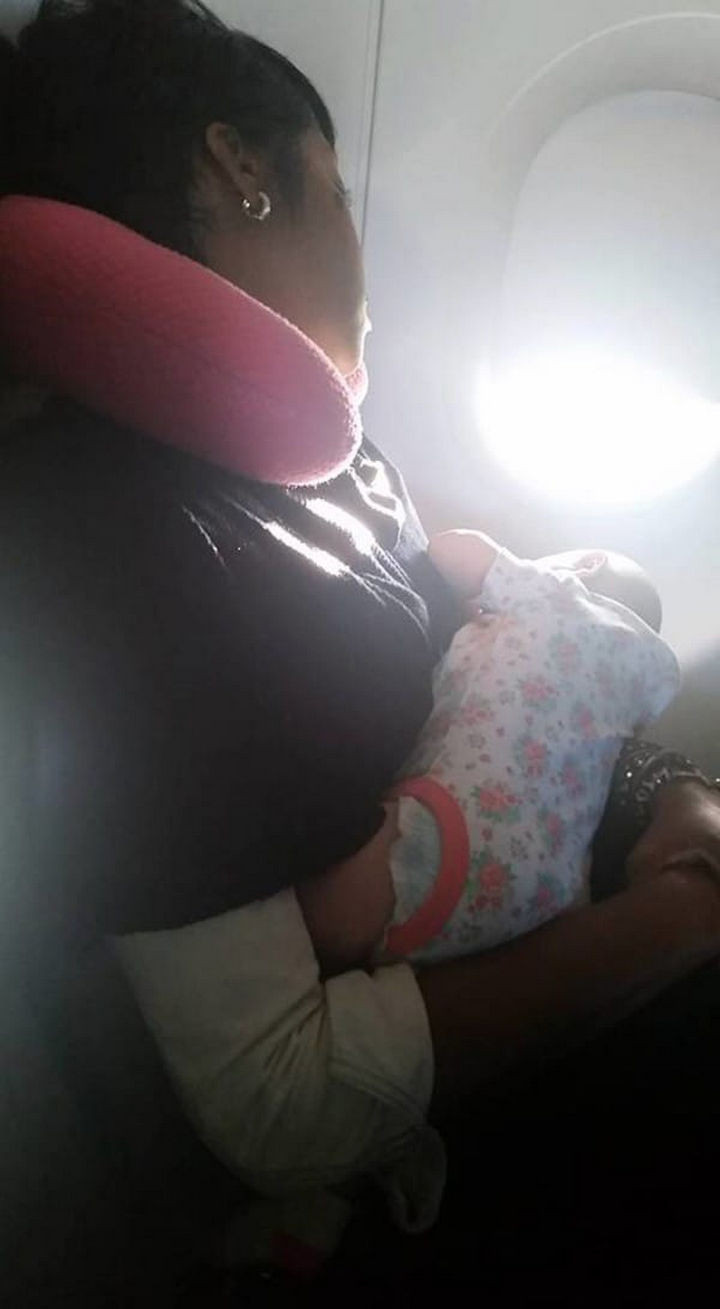 Even after they moved seats, her baby wouldn't stop crying. A woman sitting next to her, Nyfesha, asked if she could hold her crying baby. Within minutes, the baby stopped crying and began looking out the plane window.