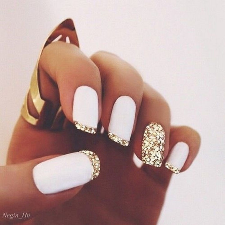 17 French Nails With a Twist - Striking matte white with gold glitter.