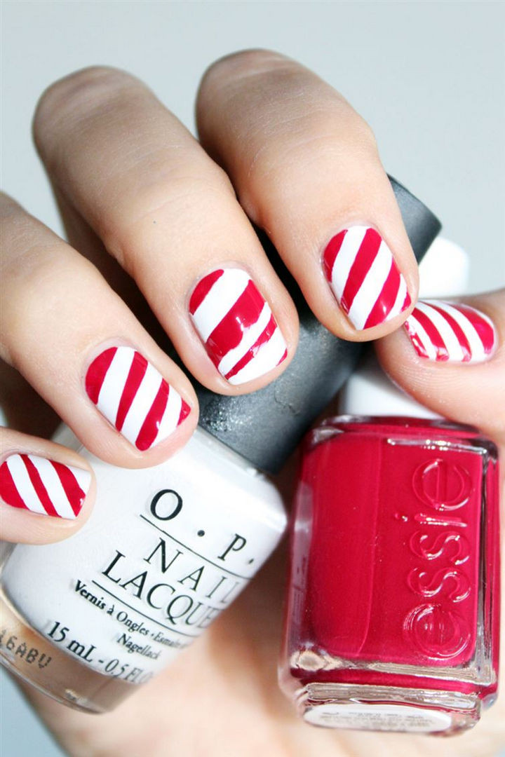 Get festive with sweet candy cane nails.