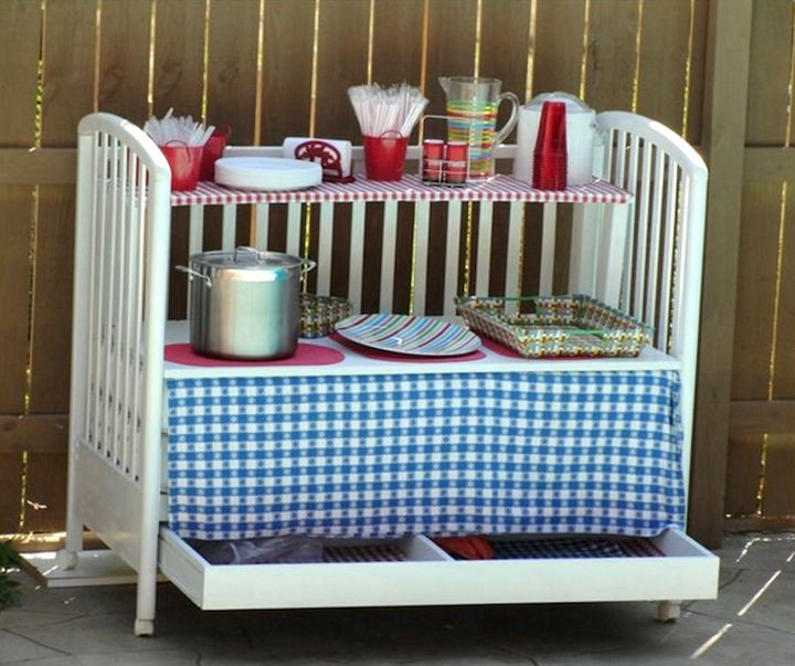 19 Ways to Repurpose Baby Cribs - Create an outdoor serving table on wheels.