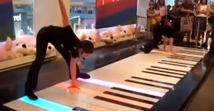 Two Women Playing Bach's Toccata in D on a Giant Floor Piano.