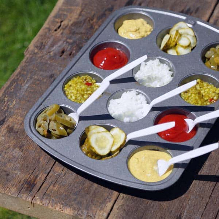 13+ Muffin Pan Hacks - Serve condiments in a muffin tray.