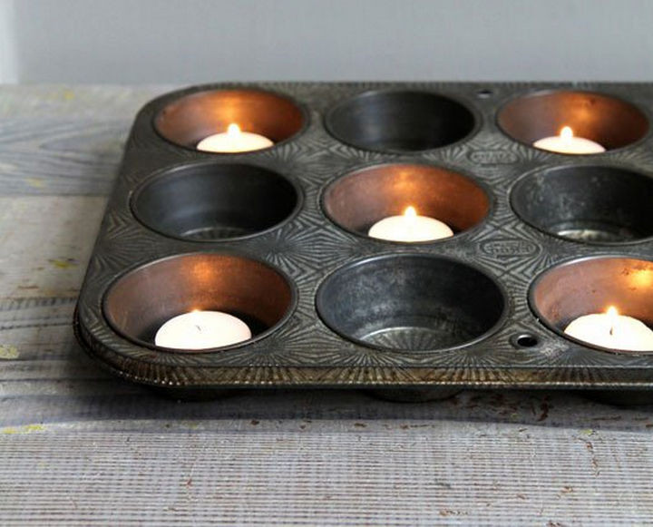 13+ Muffin Pan Hacks - Use a muffin tray as a votive candle holder.