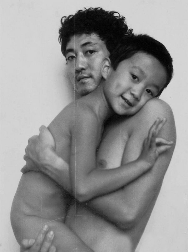 Father takes photo with his son every year. This one was taken in 1990