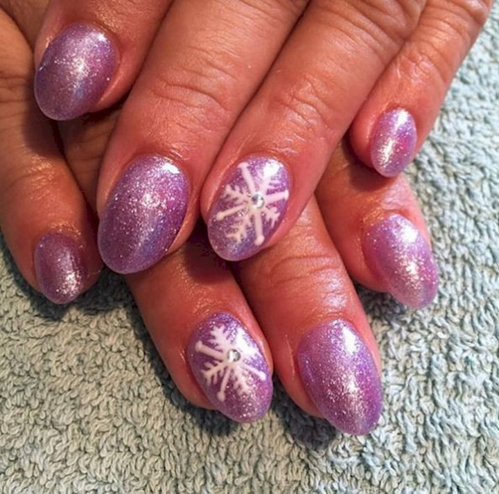 18 3D Nails - A shimmering winter style with textured snowflake accent nails.