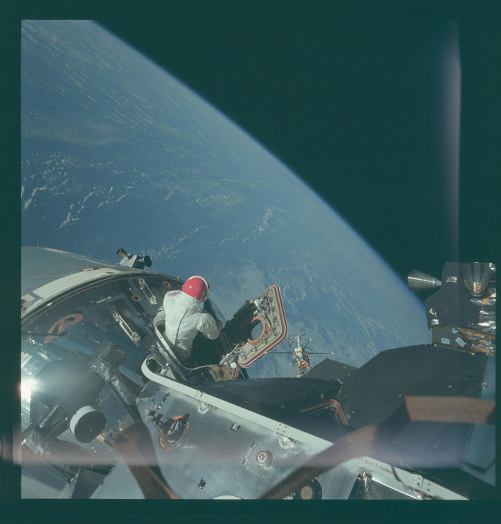 35 Rare Historical Photos - 1969: Astronaut David Scott taking in the incredible view from space during an EVA from Command Module Gumdrop.