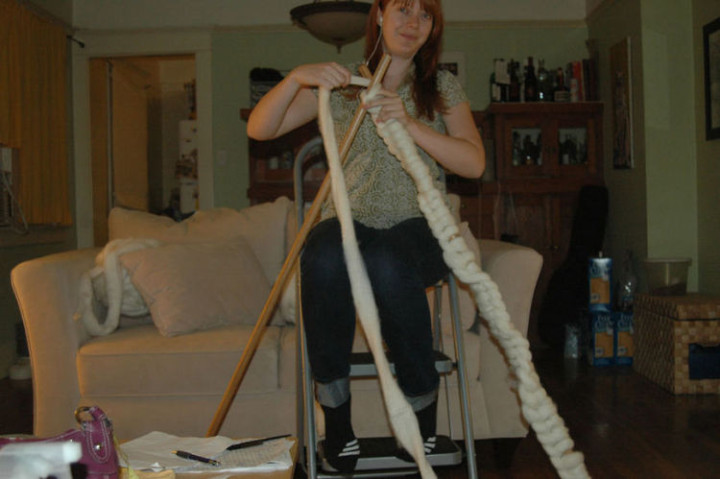 She originally created "knitting needles" with broomsticks but found the gauge was too tight.