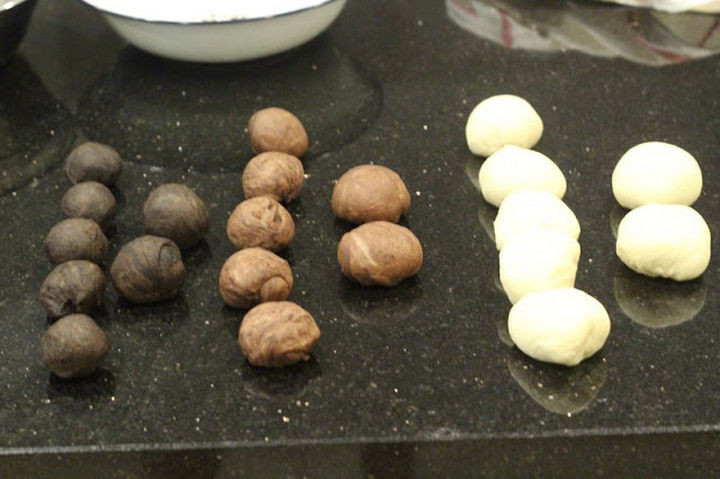 The dough is divided and rolled into smaller balls of dough.