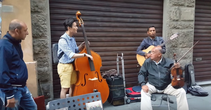Tourist Jams with Street Musicians in Italy.