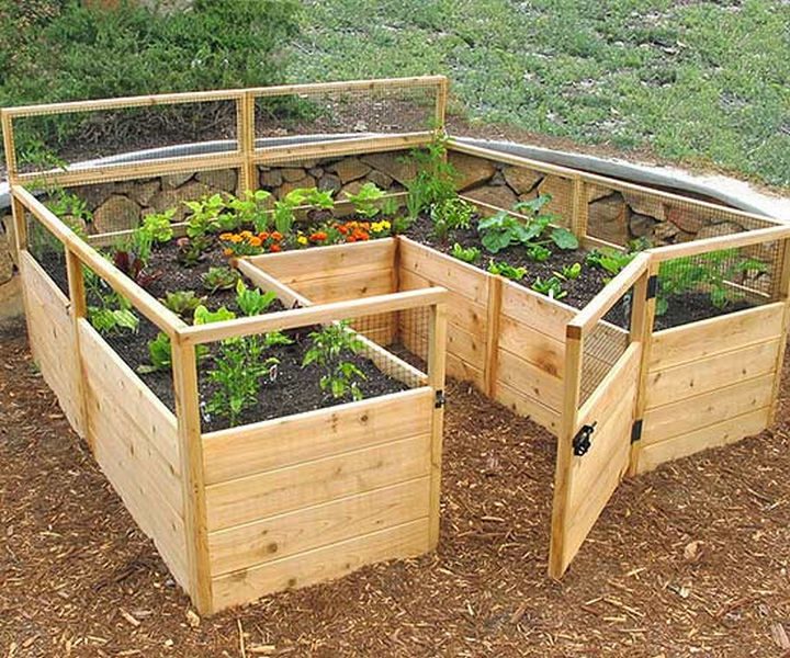 14 DIY Gardening Tips & Projects - Build a raised garden for low-maintenance gardening.