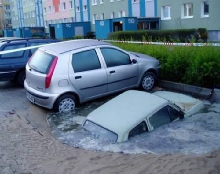19 People Having a Bad Day - He probably wasn't expecting to park into a sink hole.