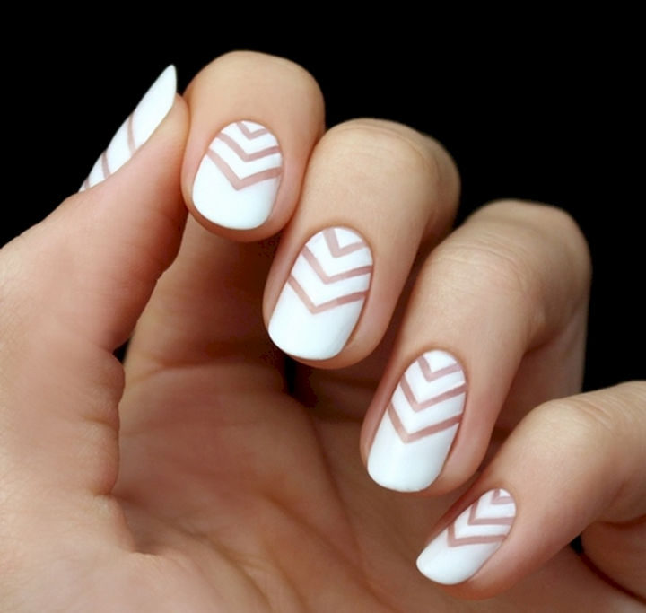 17 Chevron Nails - Striking white reverse chevron nails.