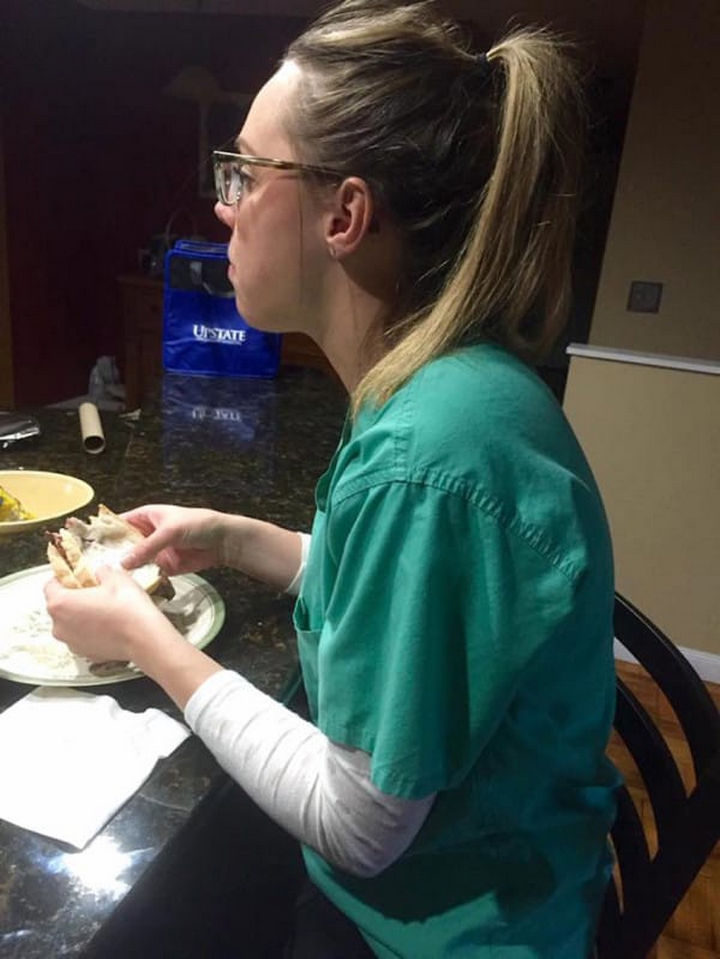 Philip Urtz writes, "This is my wife Jessica having dinner after a 14 hour day. She comes home from work, has enough time to eat and get ready for bed and it’s back to work the next day for another shift."