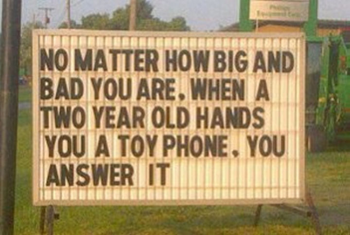23 Funny Baby Memes That Are Adorably Cute - "No matter how big and bad you are. When a two-year-old hands you a toy phone, you answer it."
