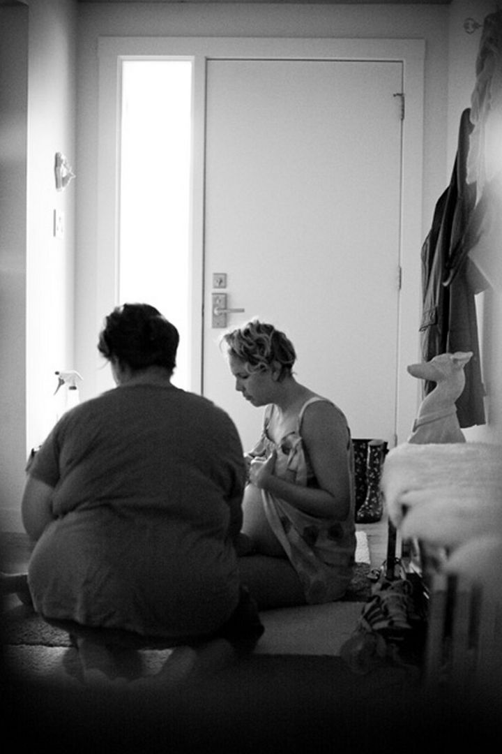 The midwife takes Erin's vitals and gets her ready for the birth of her baby daughter.