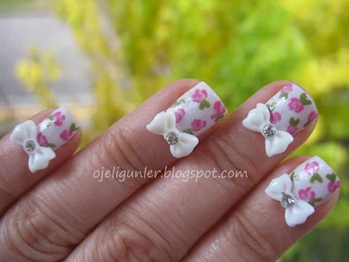 17 Bow Nail Art Designs - These floral nails are pretty but adding a bow finishes it off nicely.