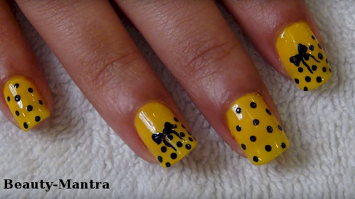 17 Bow Nail Art Designs - Yellow looks great with this polka dot bow nail art design.