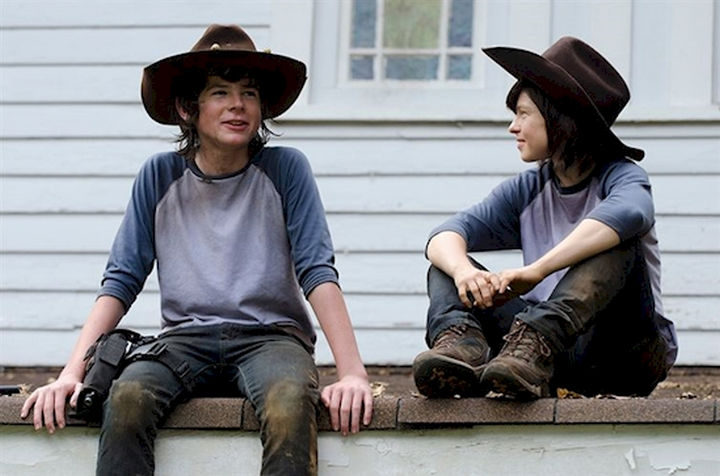 23 Celebrities Hanging Out With Their Stunt Doubles - Chandler Riggs and his stunt double on the set of AMC's "The Walking Dead."