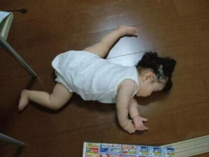 25 Kids Sleeping in the Strangest Places - Future gymnast?