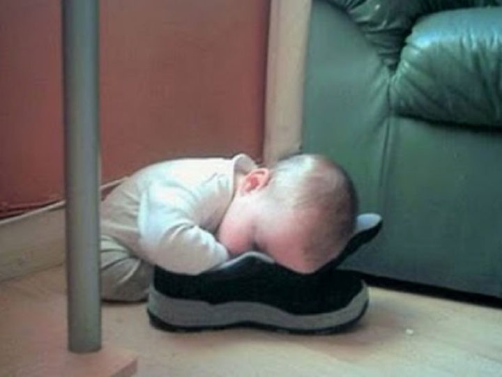 25 Kids Sleeping in the Strangest Places - He thinks this shoe is pretty comfortable!