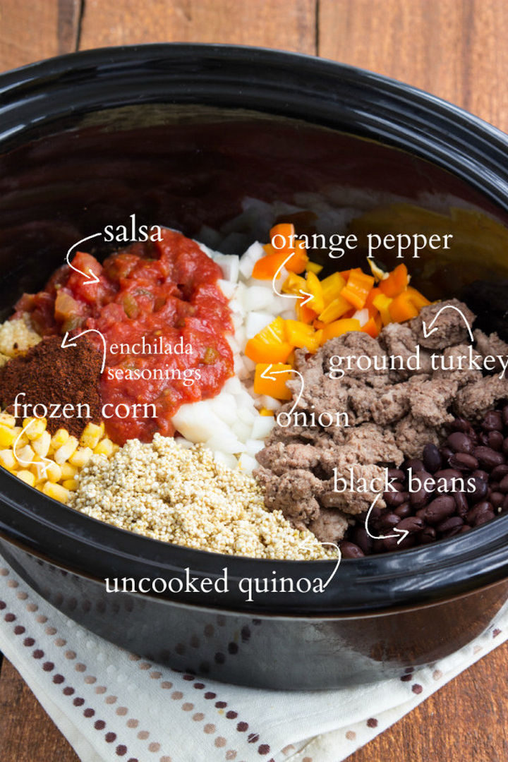 26 Crock Pot Dump Meals - Slow cooker cheesy enchilada quinoa bake.