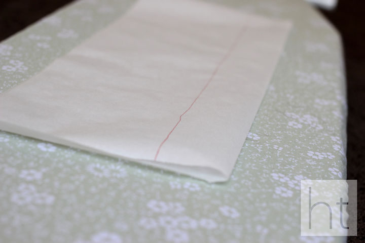 Fold it in half, length-wise and draw a line about 2-inches out from the fold.
