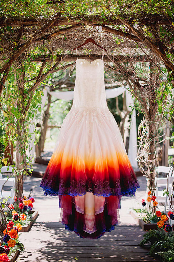 She found a wedding dress at a discount store and decided to airbrush it with 3 layers of paint and her ombre wedding dress looks gorgeous.