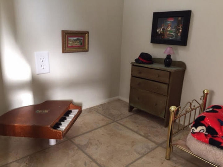 Everything is tiny and adorable. A tiny piano, dresser, rugs, and even a tiny lamp.