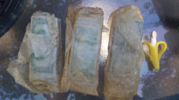 He pulled out three other packages wrapped in wax paper and the contents almost appear green!