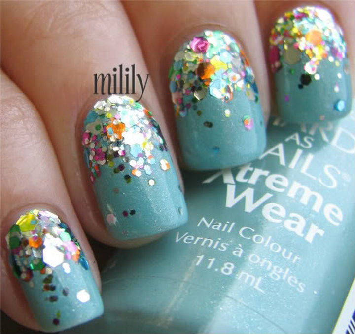Glittering rainbow reverse gradient on a blue base.
