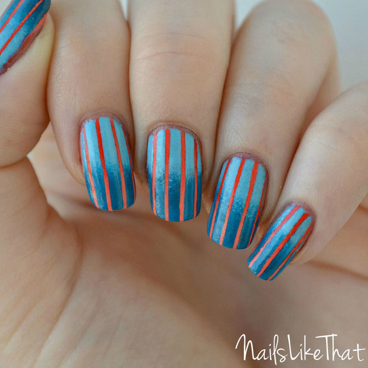 Orange and blue look great together with these reverse gradient nails.