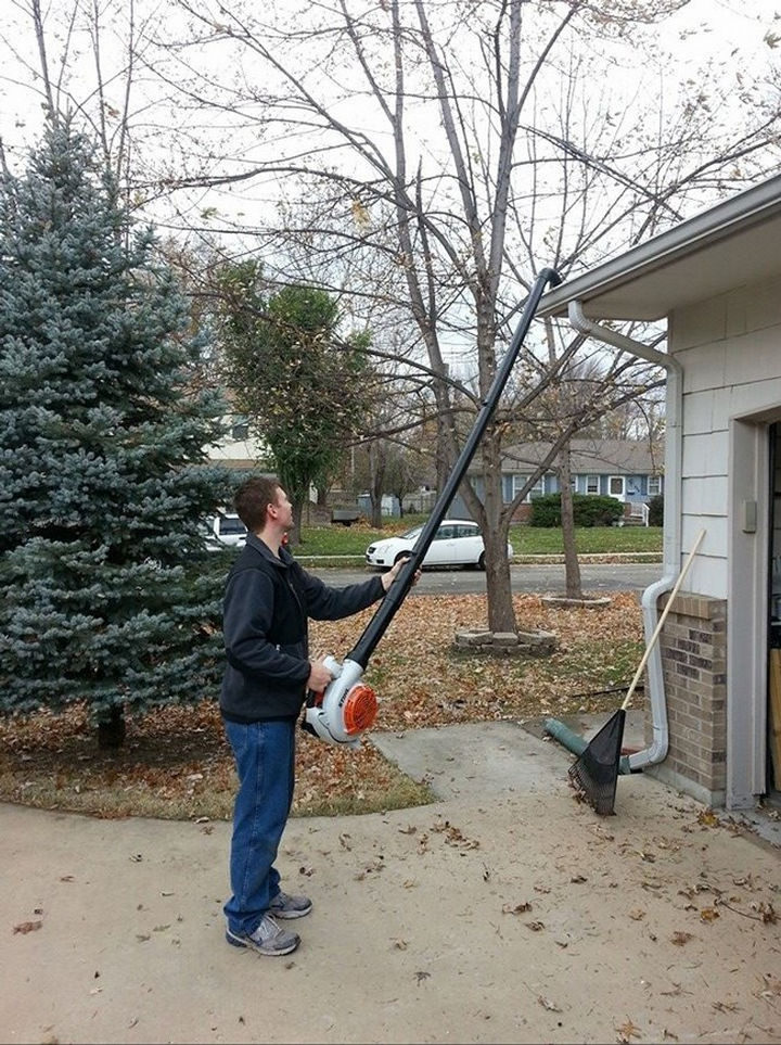 Attach PVC pipes together and secure it to your leaf blower to easily clean your eavestroughs.
