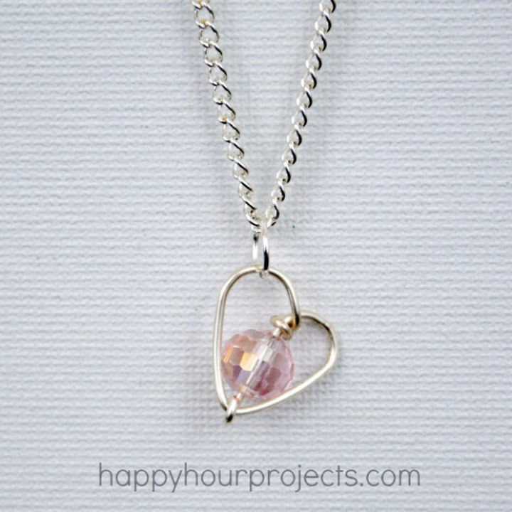 27 DIY Valentine's Day Crafts - Create a handmade DIY wire-wrapped heart necklace.