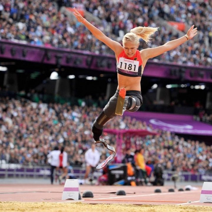 Vanessa Low, a 2016 Paralympic champion performing a world record-breaking 4.93-meter long jump.