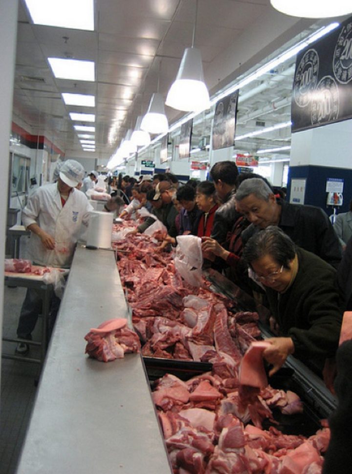 15 Items Sold at Walmart Stores in China - Open bins filled with various pieces of mixed meat.