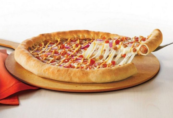 19 Ridiculous But Real Fast Food Items - Pizza Hut Hot Dog Stuffed Crust Pizza.