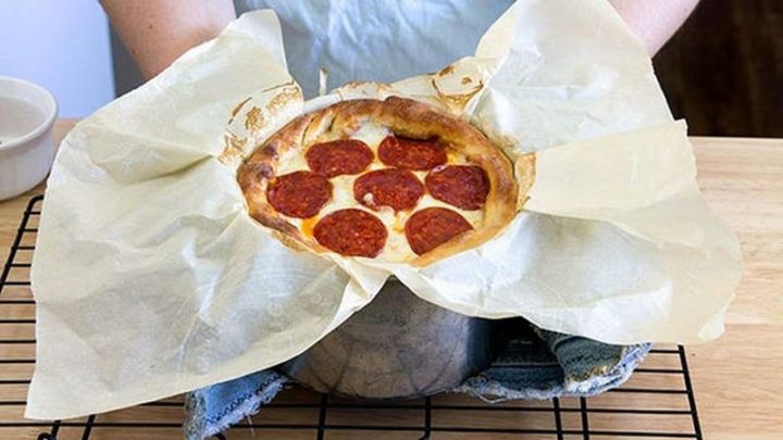 Roll up the overhanging crust to make a nice pizza crust and brush dough with melted butter. Bake at 400 degrees for 20-25 minutes and get ready for cheesy pizza goodness.