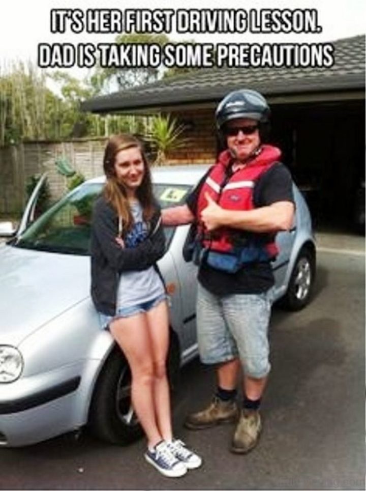 "It's her first driving lesson. Dad is taking some precautions."