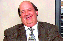 Kevin Malone from The Office laughing.