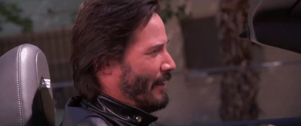 Keanu Reeves winking.