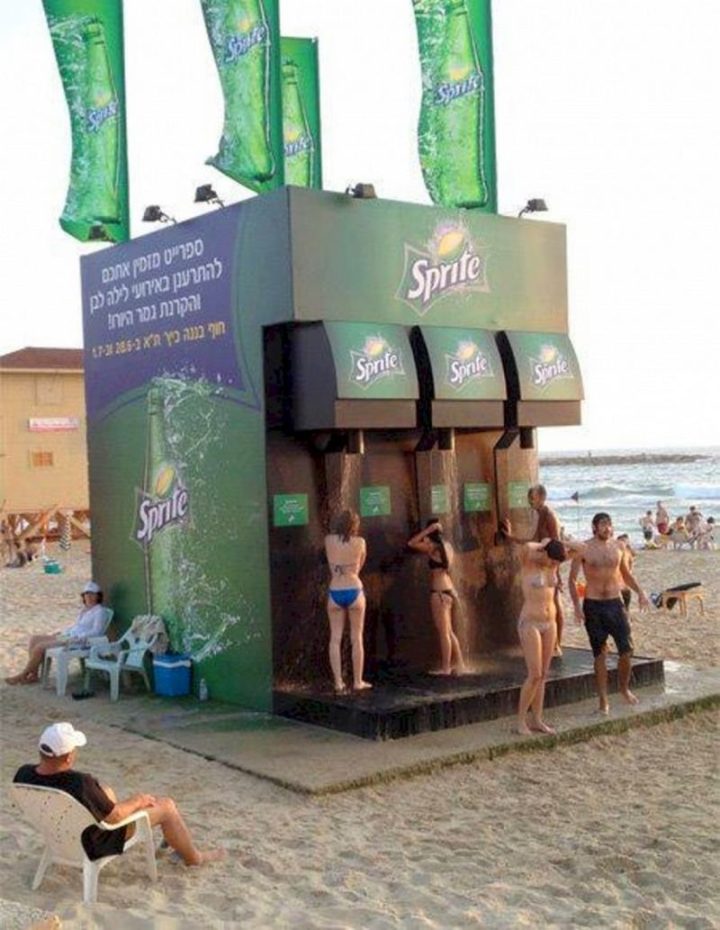 27 Awesome Billboards - Sprite creates a soda fountain machine right on the beach! Unfortunately, you're only being showered with water, not Sprite...