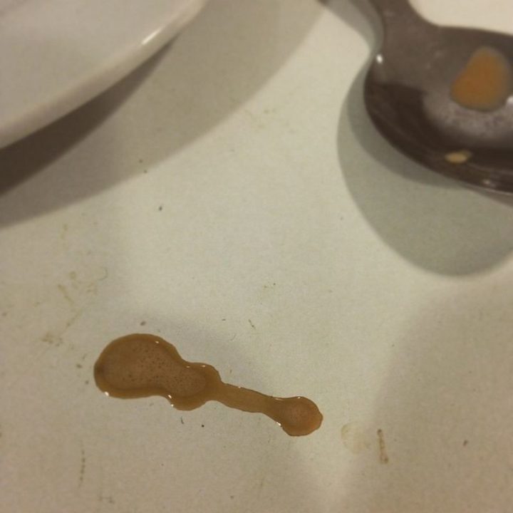 "My friend's coffee spilled in the shape of a guitar."