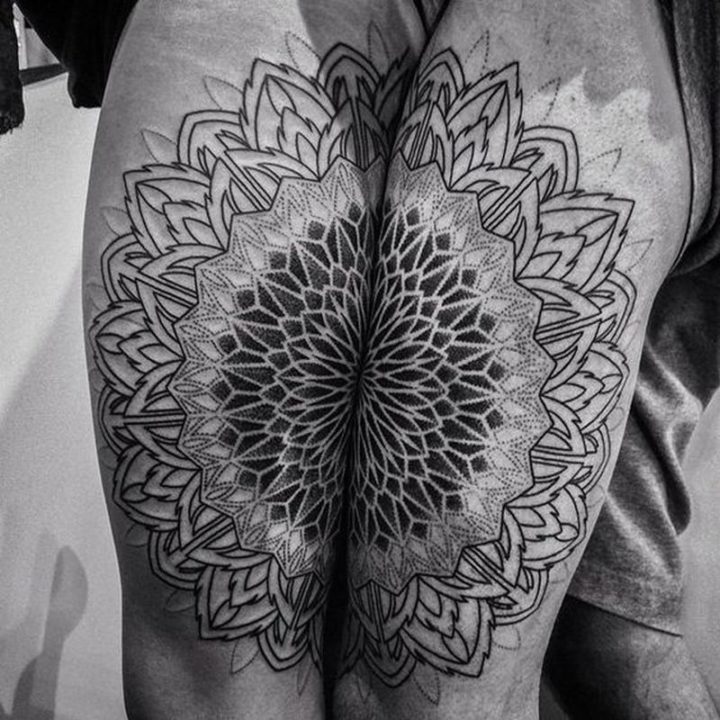 Mesmerizing split Mandala ink art on two arms perfect for couple tattoos.