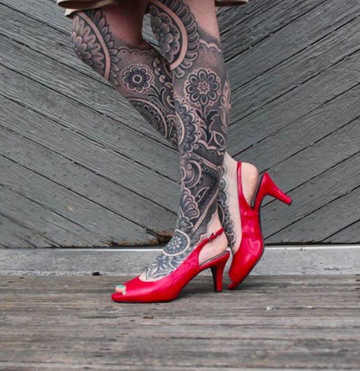 Beautiful artwork with leg mandala tattoos.