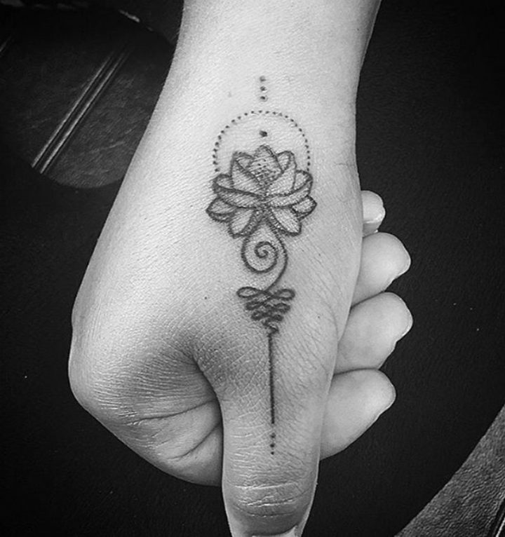 Finger lotus flower tattoo ideas.