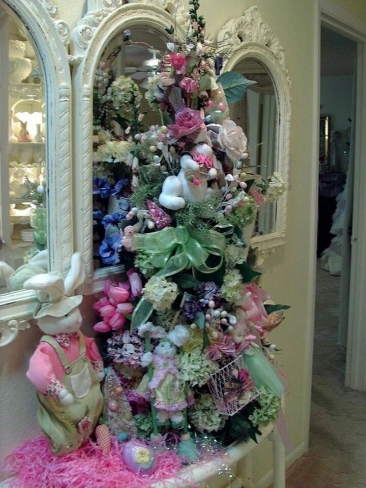 An Easter tree featuring an Easter decor trifecta of bunnies, bows, and flowers!