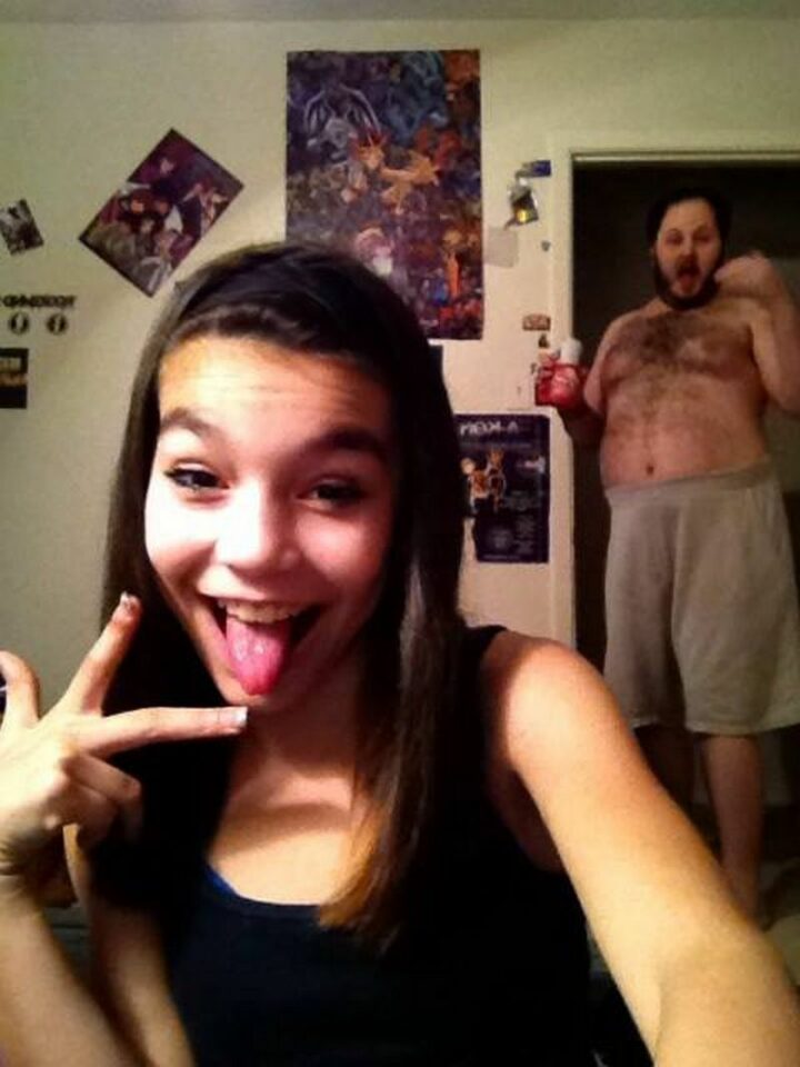 "Little Girl selfie gets photobombed by BEar-like Father."